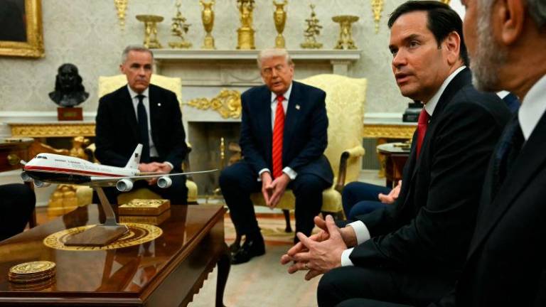 US Secretary of State Marco Rubio (2R) speaks as US President Donald Trump meets with Canadian Prime Minister Mark Carney in the Oval Office of the White House in Washington, DC, on May 6, 2025. AFPpix
