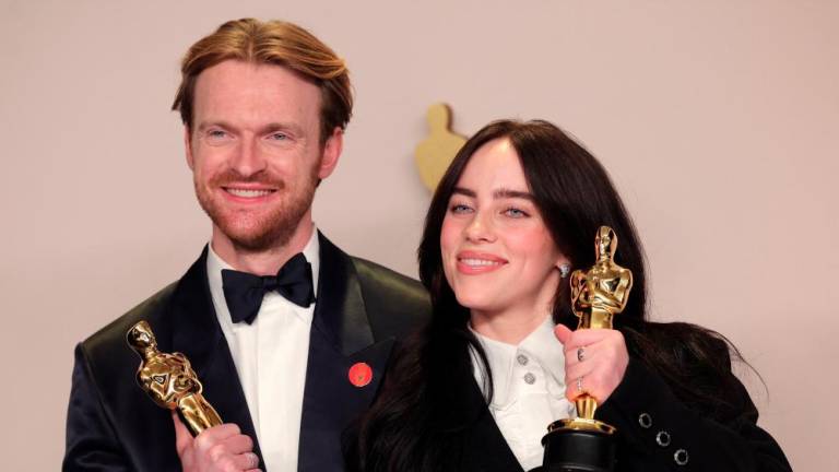 The siblings pose with the Oscar for Best Original Song for What Was I Made For? from Barbie. – REUTERSPIC