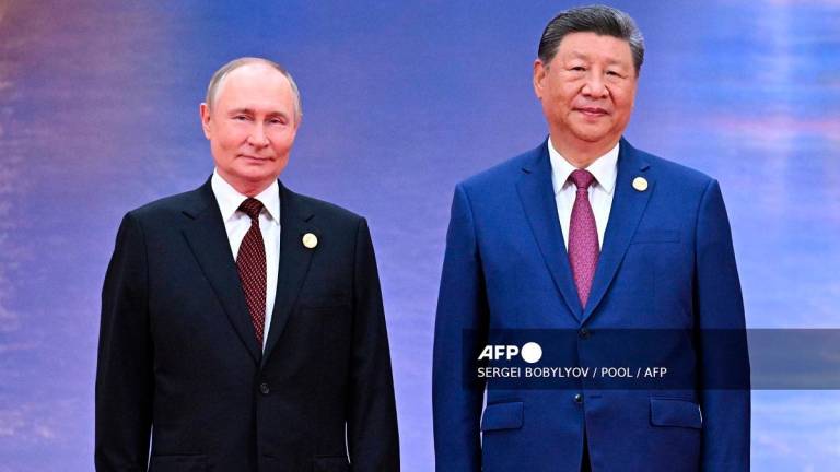 Russia’s President Vladimir Putin and Chinese President Xi Jinping pose during a welcoming ceremony of the Shanghai Cooperation Organization (SCO) Summit in Tianjin on August 31, 2025. - Sergei BOBYLYOV / POOL / AFP