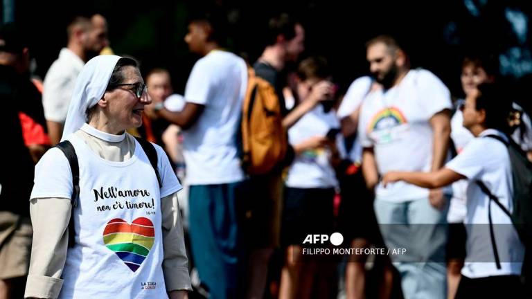 A nun wears a t-shirt reading In love there is no fear as she gathers to march with other pilgrims to pass the holy door of St Peter's basilica during the LGTB jubilee, at the Vatican, on September 6, 2025. - AFP