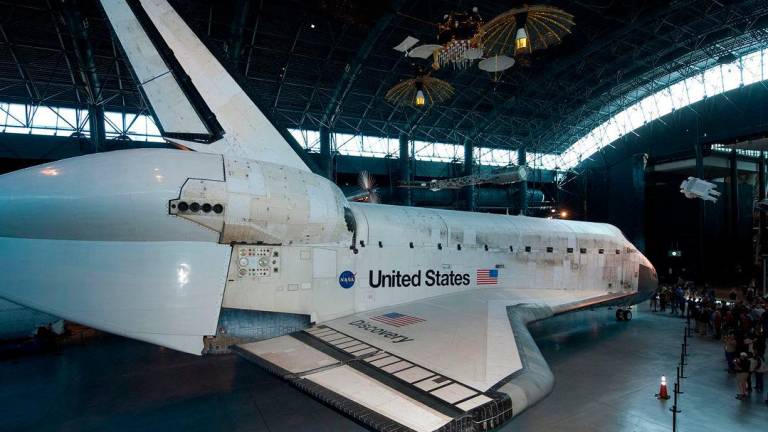This picture dated April 20, 2012 provided by the Smithsonian National Air and Space Museum shows Space Shuttle Discovery in the James S. McDonnell Space Hangar at the Udvar-Hazy Center in Chantilly, Virginia. AFP PHOTO / Smithsonian National Air and Space Museum / Mark Avino