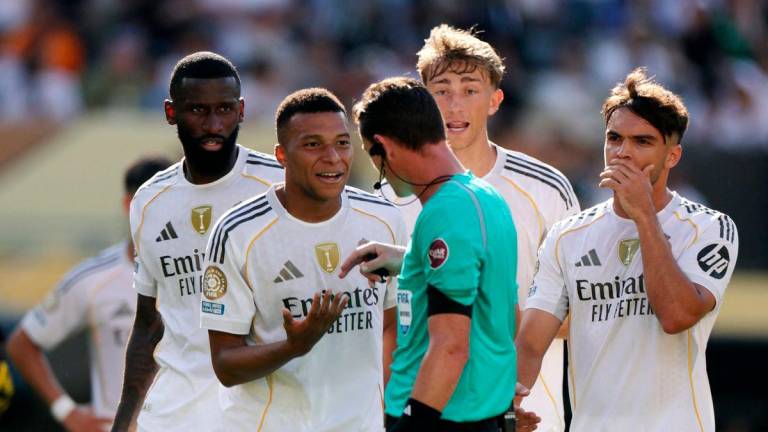 Real Madrid’s Kylian Mbappe reacts with referee Ramon Abatti-REUTERS