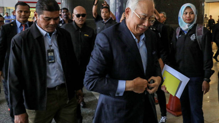 Najib claims trial to 25 charges (Updated)