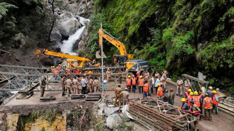 A drone view of Border Roads Organisation (BRO) and State Disaster Response Force (SDRF) officials attempting to build a makeshift bridge to reach Dharali village after the bridge connecting it was swept away during landslides in Gangnani, Uttarakhand, India, August 8, 2025. Francis Mascarenhas /REUTERS