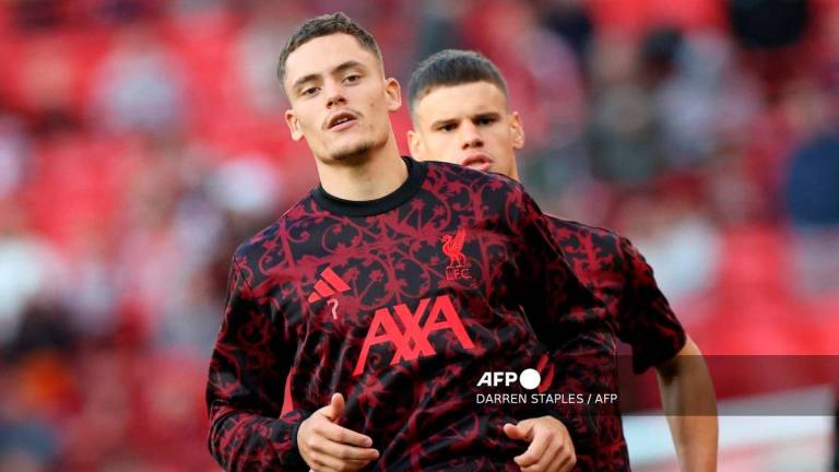 Liverpool’s German midfielder #07 Florian Wirtz (L) and Liverpool’s Hungarian defender #06 Milos Kerkez warm up ahead of the second of two pre season friendly football matches between Liverpool and Athletic Bilbao at Anfield in Liverpool, north west England on August 4, 2025. - AFP
