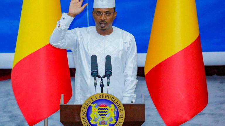 Chad’s newly elected President and junta leader Mahamat Idriss Deby raises his hand during his inauguration ceremony in N’djamena, Chad May 23, 2024. REUTERSpix
