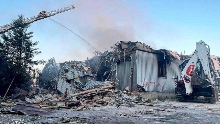 This handout picture taken and released by Ukrainian State Emergency Service on July 16, 2025 shows firefighters extinguishing a fire on a civilian installation following Russian strike in Dobropillia, Donetsk region, amid Russian invasion in Ukraine. - Handout / UKRAINIAN STATE EMERGENCY SERVICE / AFP