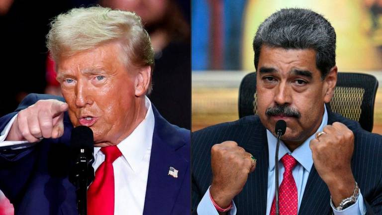 This combination of pictures created on August 07, 2025 shows US President Donald Trump (L) in Grand Rapids, Michigan on November 5, 2024, and Venezuelan President Nicolas Maduro (R) in Caracas on July 31, 2024. - AFPPIX