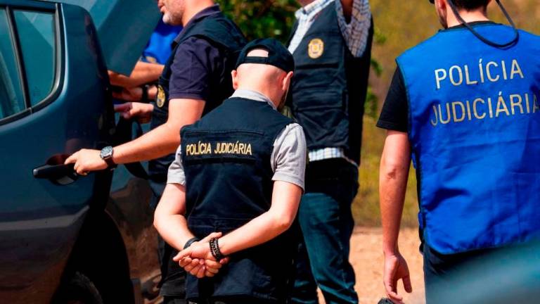 Officers of Portugal’s investigative Judicial Police are seen at the site of a remote reservoir where a new search for the body of Madeleine McCann is set to take place, in Silves, Portugal. REUTERSPIX