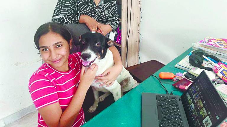 Thaynhiskha enjoys her digital classes, seen here at home with mother Deepa, where she rests in between her lessons.