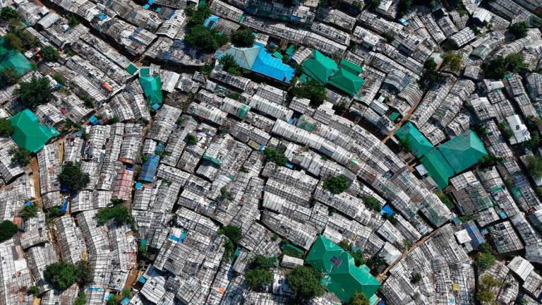 An aerial view shows Rohingya refugees’ Balukhali camp in Ukhia on August 26, 2025. “Bangladesh now hosts 1.3 million forcibly displaced Rohingya from Myanmar,“ Yunus told the aid conference in Cox’s Bazar, calling it the “largest refugee camp in the world”. - Piyas Biswas / AFP