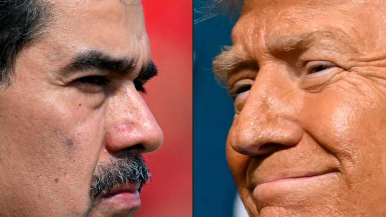 (FILES) (COMBO) Venezuela's President Nicolas Maduro (L) and US President Donald Trump (R)- Juan BARRETO and ANDREW CABALLERO-REYNOLDS / AFP