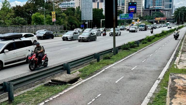 Although motorcyclists risk being fined for riding on major roads, many believe it is the lesser of two evils compared with the dangers of motorcycle lanes. – ADAM AMIR HAMZAH/THESUN