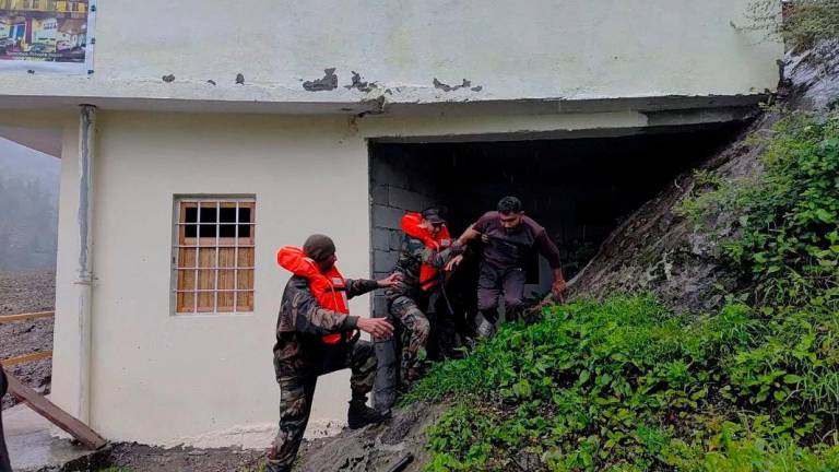 Rescuers assist a man, amid flash floods, in Dharali, Uttarakhand, India, August 5, 2025 in this handout image. Indian Army Central Command/Handout via REUTERSPix