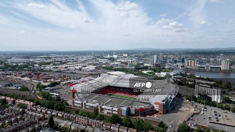 An aerial view shows Old Trafford stadium, home ground of Manchester United Football Club. - (Photo by Oli SCARFF / AFP)
