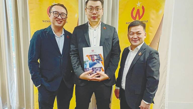 From left: Winstar Capital chief operating officer Lee Yong Zhi, Chua and chief financial officer Sheng Toi Sei.