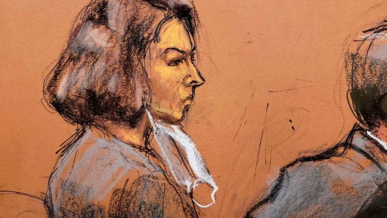 Jeffrey Epstein associate Ghislaine Maxwell sits at the defense table as juror number 50 answers questions from Judge Alison Nathan about his answers on the juror questionaire in a courtroom sketch in New York City, U.S., March 8, 2022. - Reuterspix