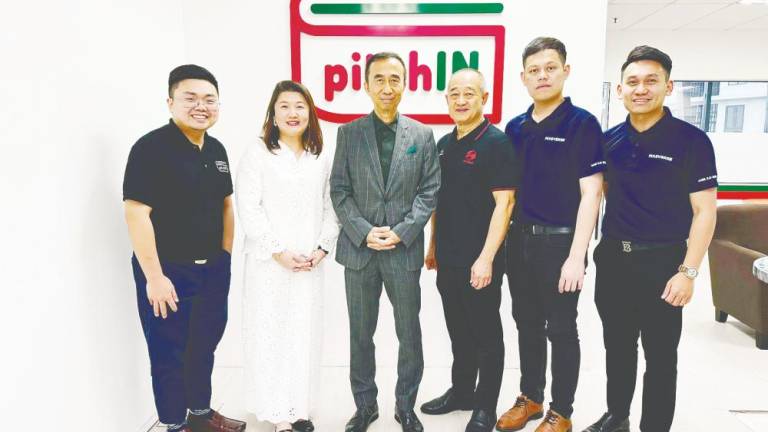 From left: pitchIN vice-president of commercial &amp; product Nicholas Chong and COO Xelia Tong; Khoo; Ni Hsin head of corporate and business development Alvin Gan; and Masverse CEO KK Chew and CFO SJ Koay.