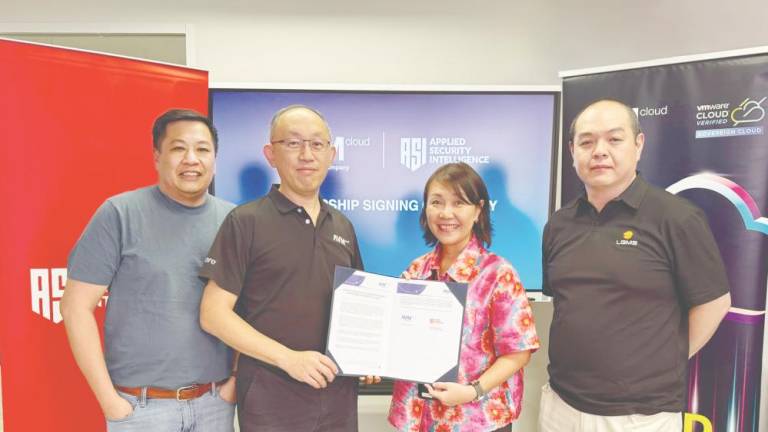 From left: AVM Cloud chief technology officer Lai Eong Hua, Lim, ASI Sdn Bhd general manager Chee Anne, and LGMS Bhd executive chairman Fong Choong Fook.