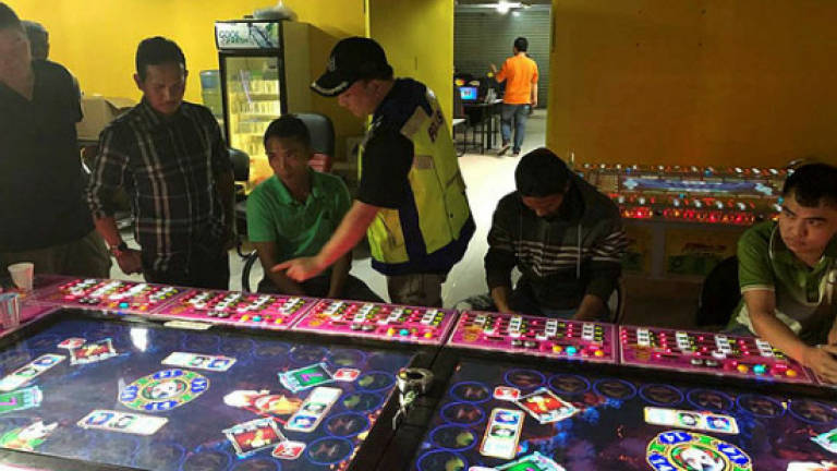 Police raid 15 illegal gambling premises Saturday, detain more than 100 people
