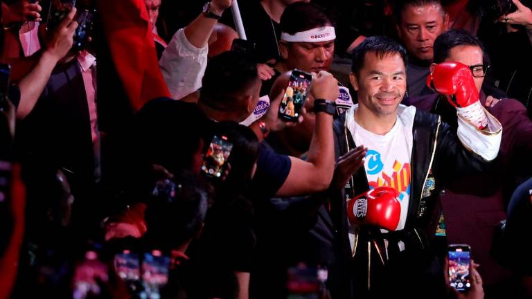 Manny Pacquiao makes his ring walk before his WBC welterweight title fight against Mario Barrios at MGM Grand Garden Arena on July 19, 2025 in Las Vegas, Nevada. The fight was declared a majority draw and Barrios retained his title. - Ethan Miller/Getty Images/AFP