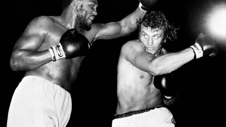 US Heavyweight boxer Joe Frazier (L) and British Heavyweight boxer Joe Bugner (R) fight at Earls Court Arena in London on July 2, 1973. Central Press/AFPPix