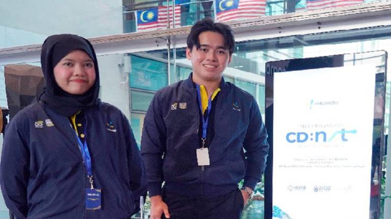 Nur Diny Inara Zalfitri (left) and Par Junn Qi during the launch of the CD:NXT programme