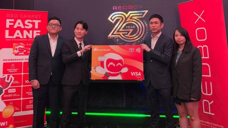 (From left to right) Red Box Group CEO Karl Khoo; Red Box Group General Manager Terry Swee; TOGL Technology Chief Marketing Officer Calvert Choo; RewardsLink Business Development Manager Alice Lua.