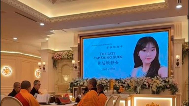 A screengrab from a video of the wake ceremony for the 16-year-old female student who was fatally stabbed in a Selangor school, posted by her mother. Credit Aapple Wong Facebook page
