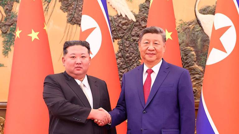 Chinese President Xi Jinping and Democratic People's Republic of Korea (DPRK) leader Kim Jong Un shake hands at the Great Hall of the People in Beijing, China September 4, 2025. - China Daily via REUTERS