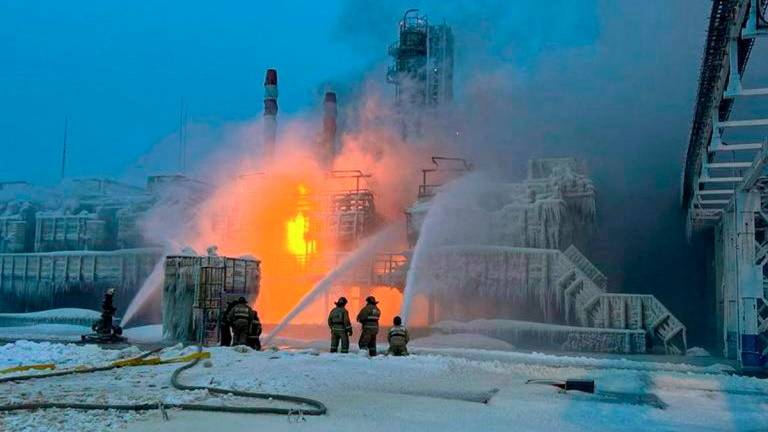 Firefighters work to extinguish fire at the Novatek terminal in the port of Ust-Luga, Russia, January 21, 2024. Leningrad Region's Governor Alexander Drozdenko Telegram channel via REUTERS