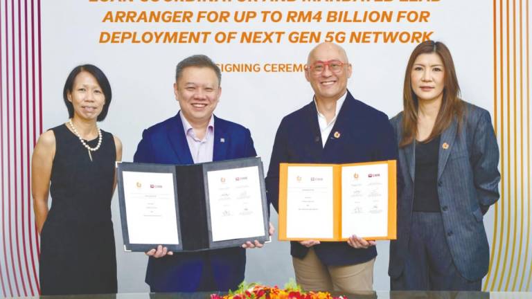 From feft: Denise Wong, Chu, Heang Tuck and Tsang at the signing ceremony.