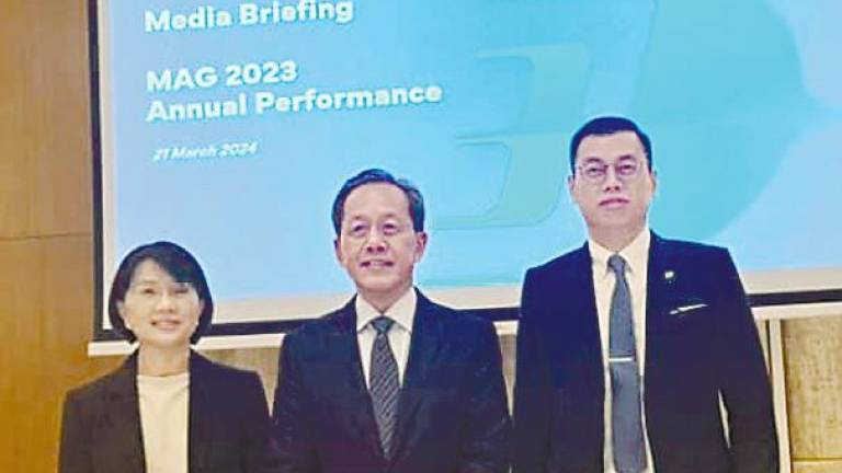 From left: MAG group CFO Boo Hui Yee, Izham and group chief strategy and transformation Bryan Foong at the results briefing.