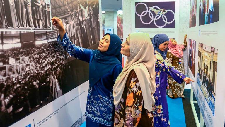 Media staff visiting a photography exhibition held in conjunction with the National Journalists’ Day 2025 celebration in Kuala Lumpur yesterday. – ADAM AMIR HAMZAH/THESUN