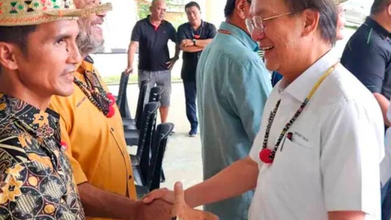 Sarawak Deputy Minister for project monitoring, labour and immigration Datuk Gerawat Gala greeting natives in Long Kevok in Baram district in northern Sarawak. Pix by Datuk Gerawat office