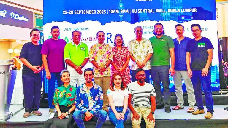 Gulshan (standing, centre) and Mandeep (seated, 2nd left) with some of the partners, including former MVS president Rajkumar Sheth (standing, 3rd left), Nitesh (4th left), Pishu (6th left) and Goh (seated, left).