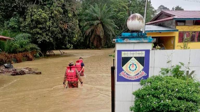 The Saratok district hit by sudden floods as emergency evacuation gets carried out in schools and longhouses. - Pic courtesy of Sarawak Fire and Rescue Department