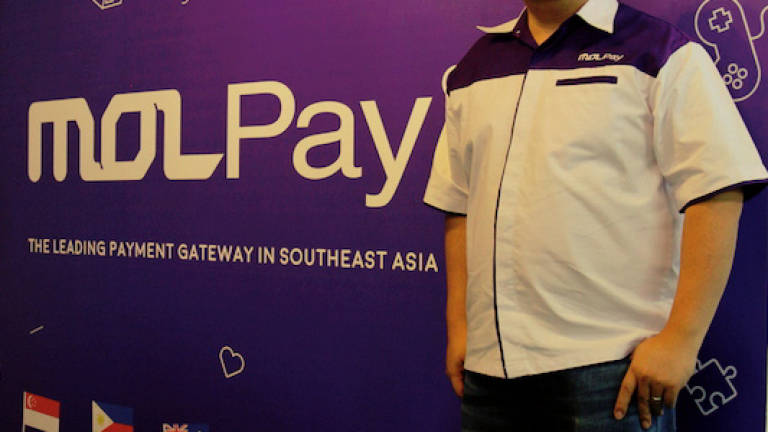 MOLPay, 7-Eleven team up to launch MOLPay CASH