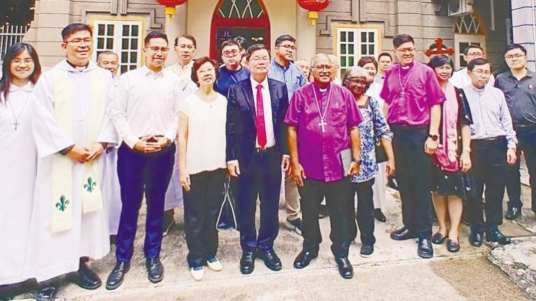 Chow (centre) with church officials and dignitaries during the groundbreaking ceremony. – T.C. KHOR/theSun