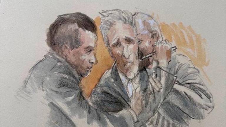 Ryan Routh, 59, appears to try to stab himself with a pen after the verdict is read finding him guilty for the attempted assassination of Donald Trump, then a former U.S. president and Republican presidential candidate, when he pointed a rifle through a fence while Trump was golfing at the Trump International Golf Club in West Palm Beach, at a courthouse in Fort Pierce, Florida, U.S., September 23, 2025, in this sketch. - REUTERSPIX