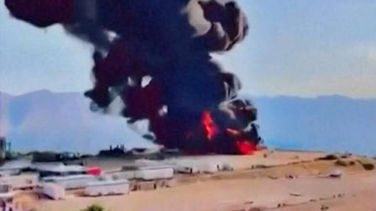 Black smoke rises from a roaring fire at Sarsang oilfield, following a drone attack, in Dohuk, Iraq July 15, 2025, in this screen grab taken from a handout video. KURDISTAN 24/Handout via REUTERSPIX