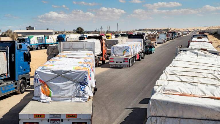 Trucks carrying humanitarian aid prepared by the Egyptian Red Crescent, which are to enter the Rafah crossing into the Gaza Strip on October 15 2025, line up, after a ceasefire between Israel and Hamas in Gaza went into effect, in Al-Arish, the capital of the North Sinai Governorate, Egypt, October 14, 2025. - REUTERSPIX