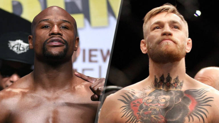 McGregor signs deal for Mayweather fight