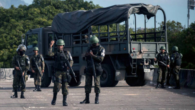 Brazil troops storm Rio slums to catch gang leaders