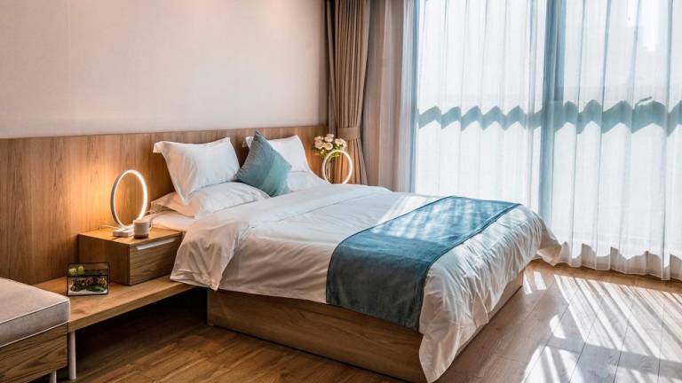 The bedroom is a sanctuary for relaxation.
