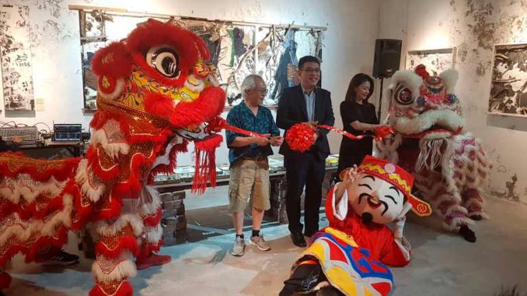 From left: Chao, Wong and Teo launching the art exhibition.