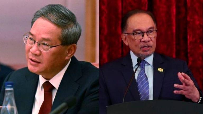 Chinese Premier Li Qiang (left), Prime Minister Datuk Seri Anwar Ibrahim (Credit - REUTERSPIX &amp; BERNAMAPIX)
