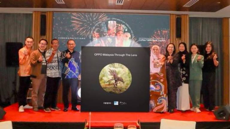 Representatives of the Malaysian National Commission for Unesco, the Ministry of Tourism, Arts and Culture and Oppo Malaysia at the unveiling of the #OppoMalaysiaThroughTheLens coffee table book.