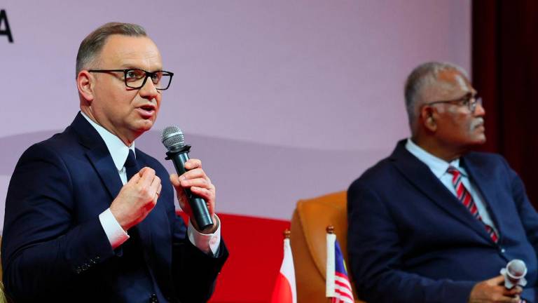 The President of Poland, Andrzej Duda, delivers a public lecture in conjunction with his official visit to Malaysia at the Auditorium of the Asia-Europe Institute (AEI), Universiti Malaya, today. - BERNAMAPIX