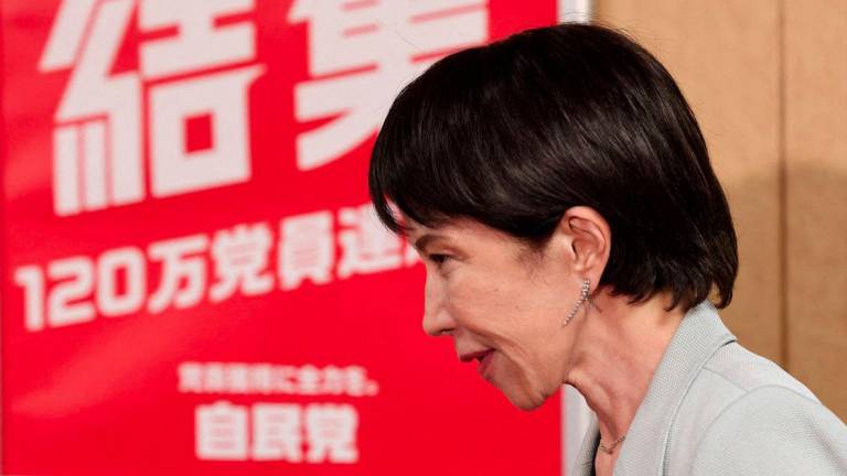 Leader of Japan's ruling Liberal Democratic Party (LDP) Sanae Takaichi leaves after a meeting with party members at its headquarters in Tokyo, Japan, October 16, 2025. - REUTERSPIX